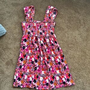 NWOT Multicolored Floral sun dress. Size small. Flowy with elasticized bust.